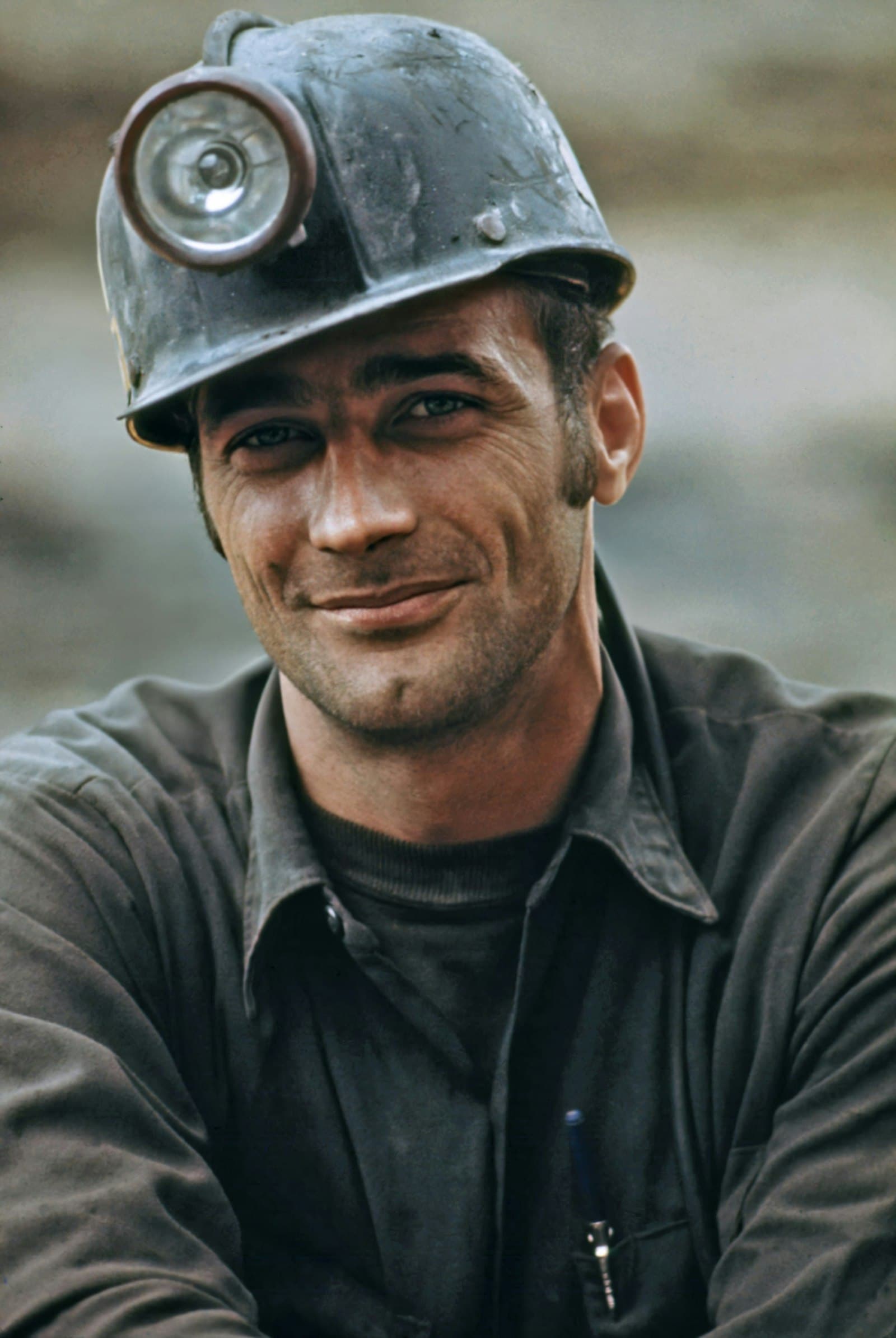 Smiling roofing professional in a hard hat